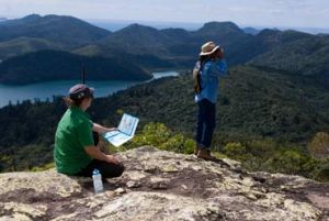 Walkers enjoy the amazing view from Whitsunday Peak.